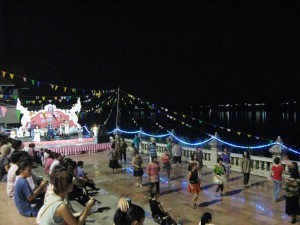 line dancing with lights of Laos in distance